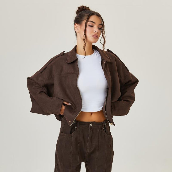 Women's pink suede cropped bomber jacket with ribbed trim, front zipper, and vintage style