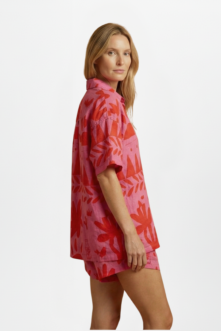 Women's pink tropical print camp collar shirt & shorts set; chic resortwear, beach outfit or summer vacation look.