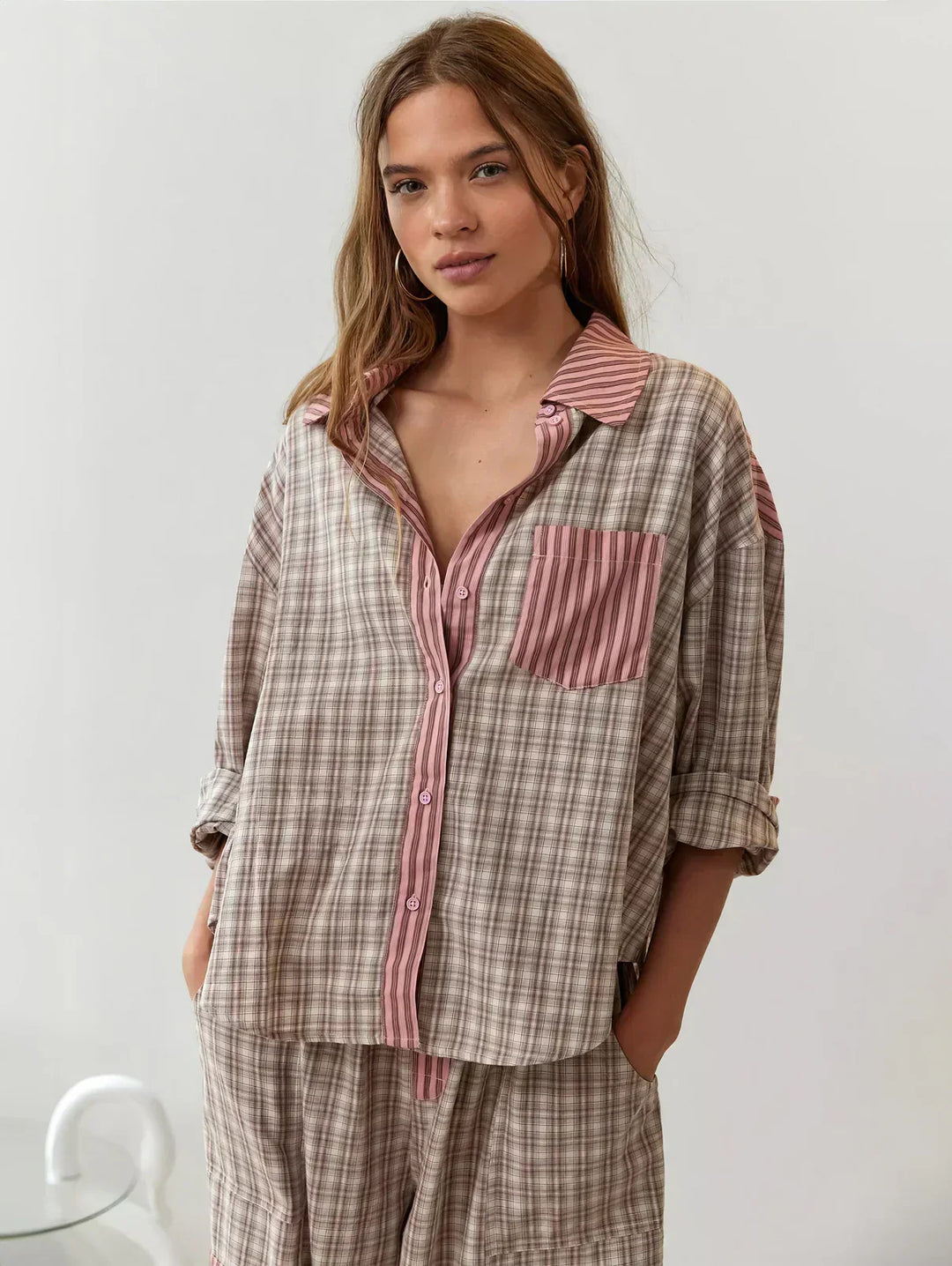 Women's plaid button-up pajama set with relaxed fit pants, perfect for cozy sleepwear.