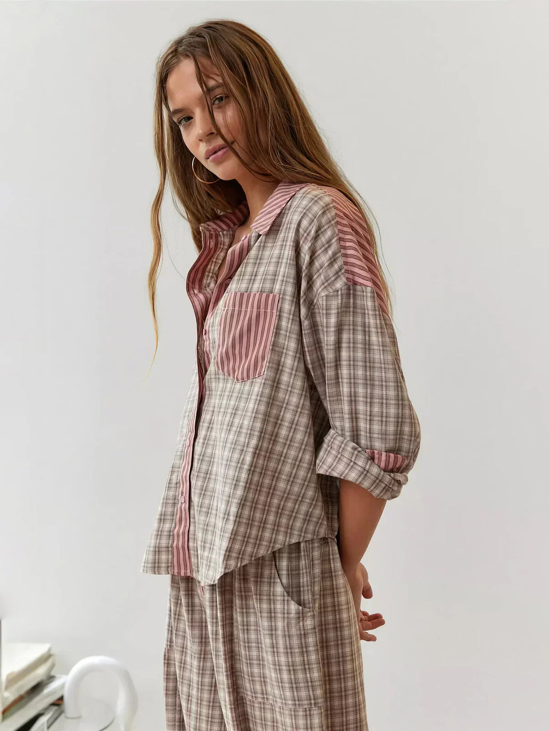 Comfortable women's plaid loungewear set; button-up top & relaxed pants for cozy home wear.