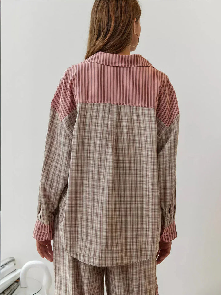Stylish two-piece women's plaid pajama set, button-up shirt & relaxed fit pants, ideal sleepwear.