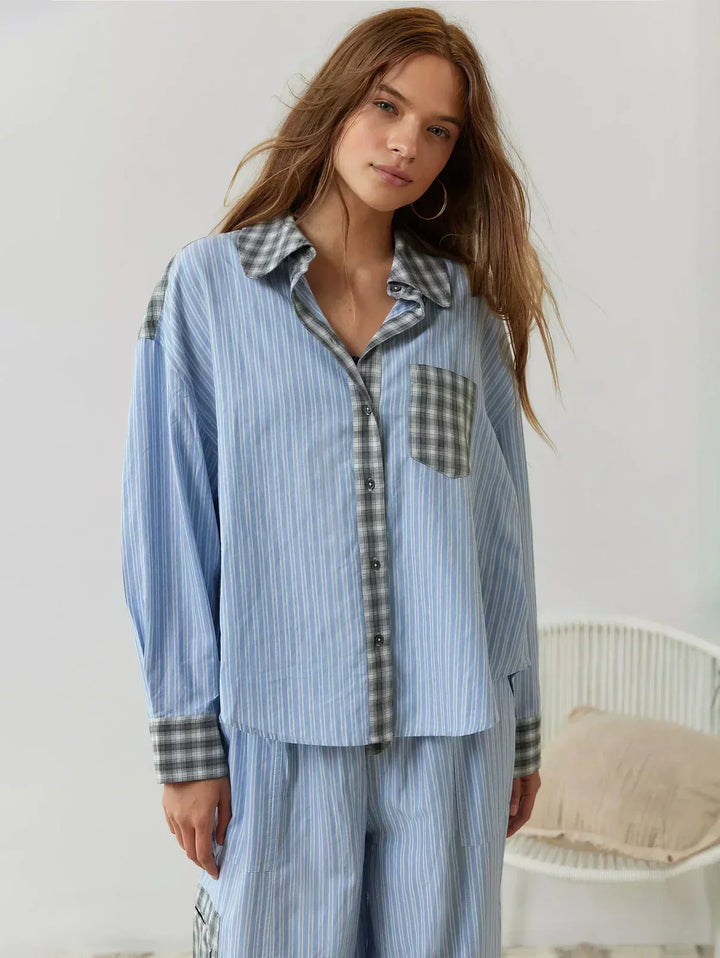 Close-up of a women's plaid button-up pajama top, featuring a relaxed fit for ultimate comfort.