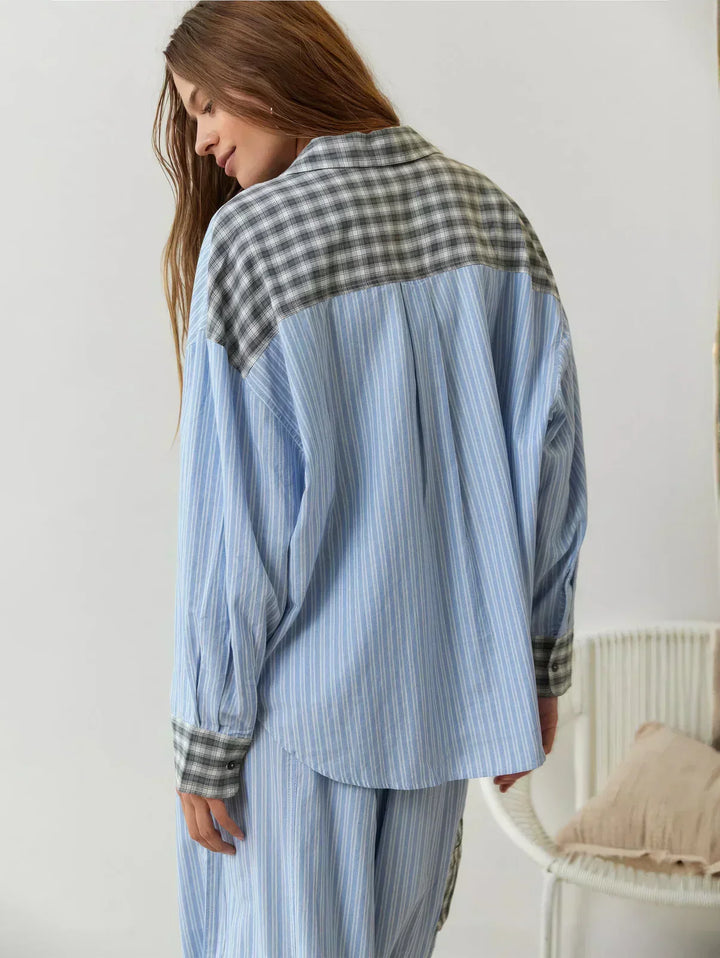 Full view of women's plaid button-up pajama set, two-piece with relaxed fit pants, ideal for comfort.