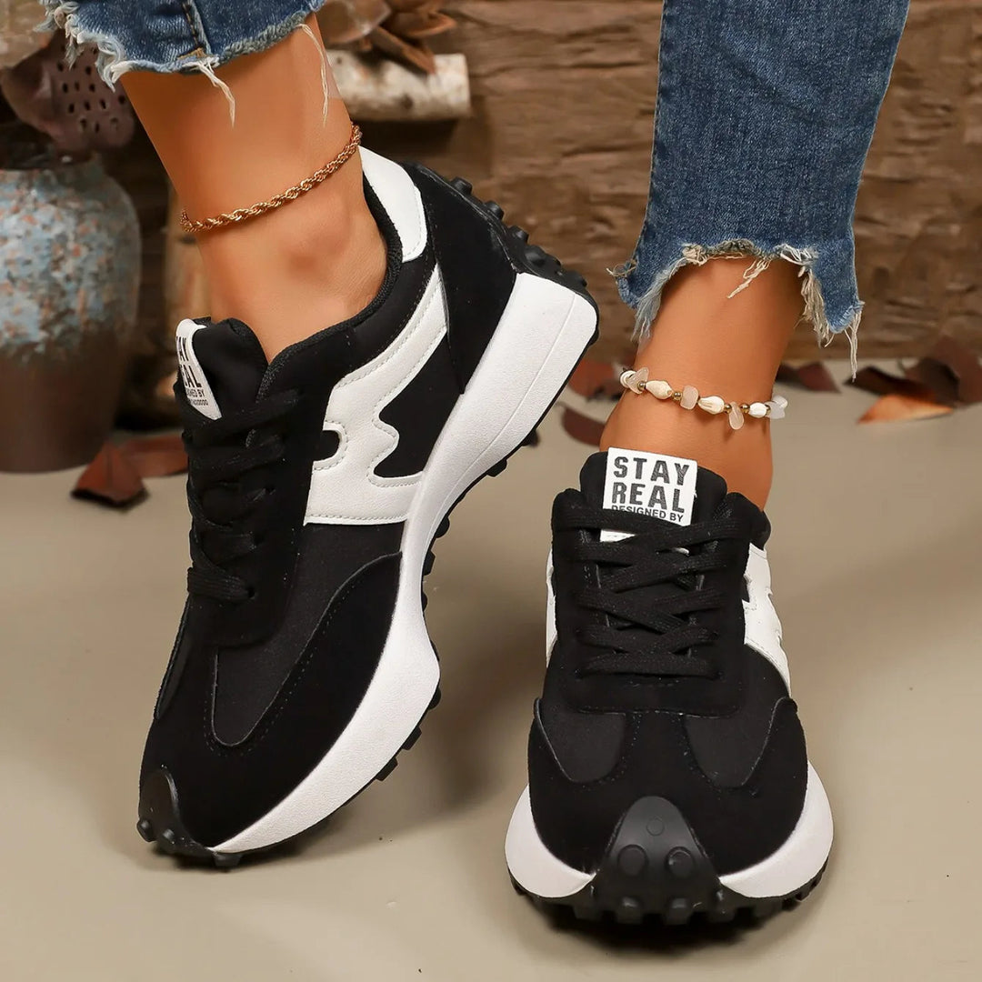 Women's striped platform lace-up athletic sneakers, combining style and comfort for casual wear.