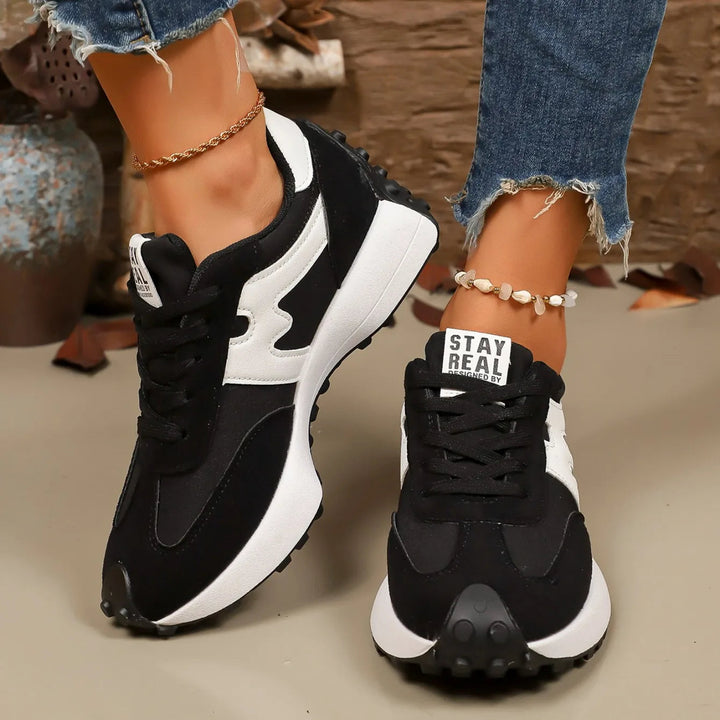 Women's striped platform lace-up athletic sneakers, combining style and comfort for casual wear.