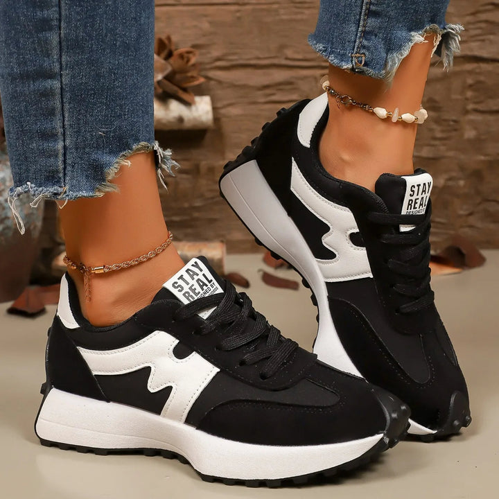 Fashionable women's platform lace-up sneakers, athletic comfort with a trendy casual design.