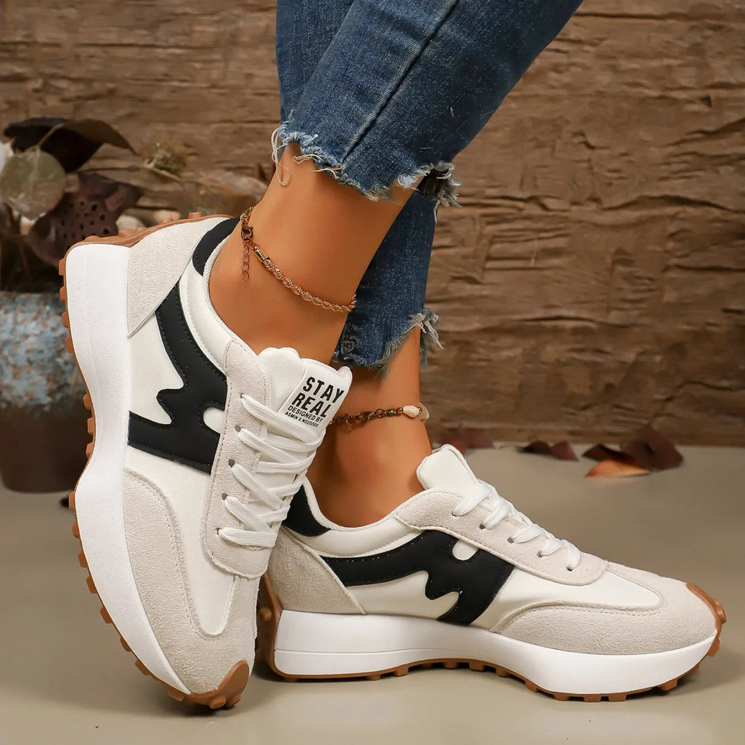 Fashionable women's striped platform sneakers, lace-up athletic style for ultimate comfort.