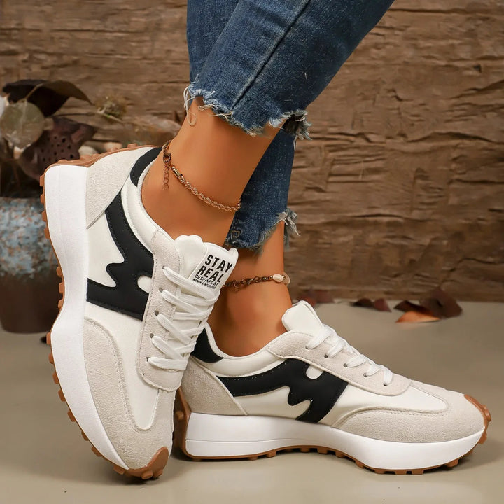 Fashionable women's striped platform sneakers, lace-up athletic style for ultimate comfort.