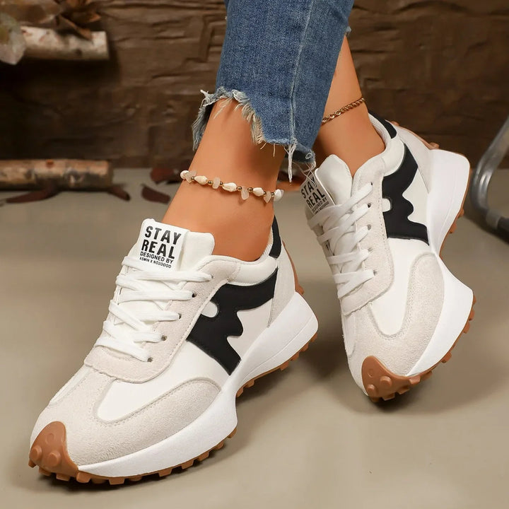 Elevated women's platform lace-up sneakers, trendy athletic design for comfort footwear.