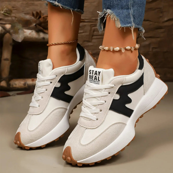 Women's lace-up platform sneakers, athletic comfort footwear for casual fashion.