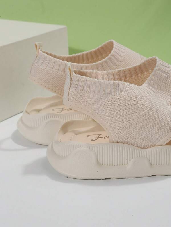 Women's walking platform sandals with open toe and slip-on style, perfect for comfortable strolls.