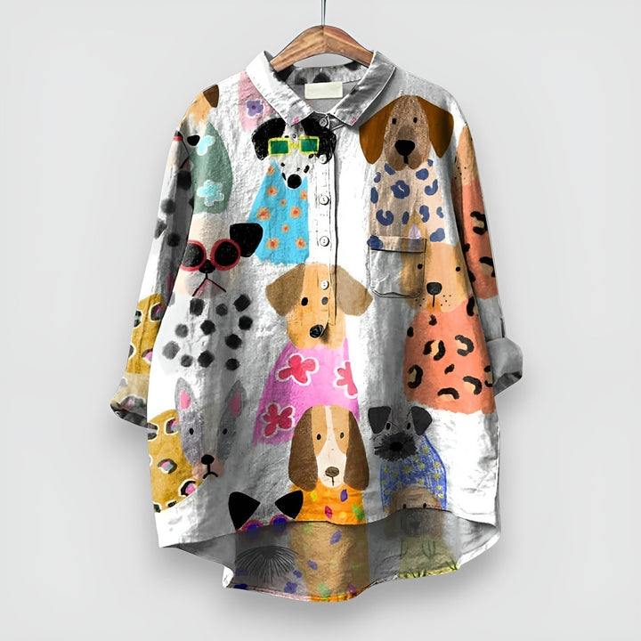 Cute women's short sleeve blouse featuring an all-over playful dog print. Casual and stylish for summer fashion.
