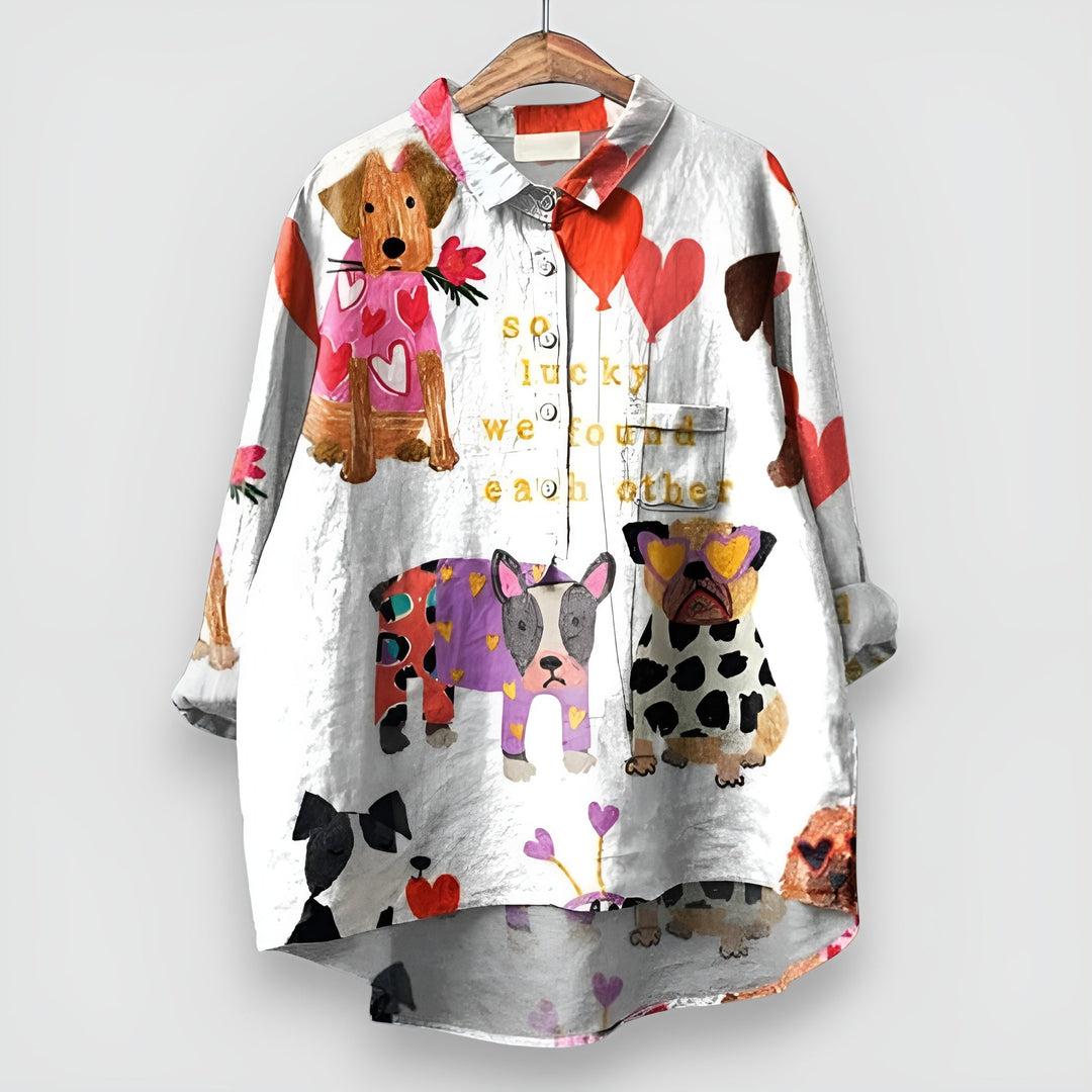 Soft women's short sleeve casual shirt. Features an adorable, playful dog print, perfect for a relaxed summer style.
