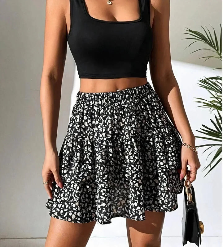 Chic women's mini dress, skirt style in a vibrant print, ideal for spring
