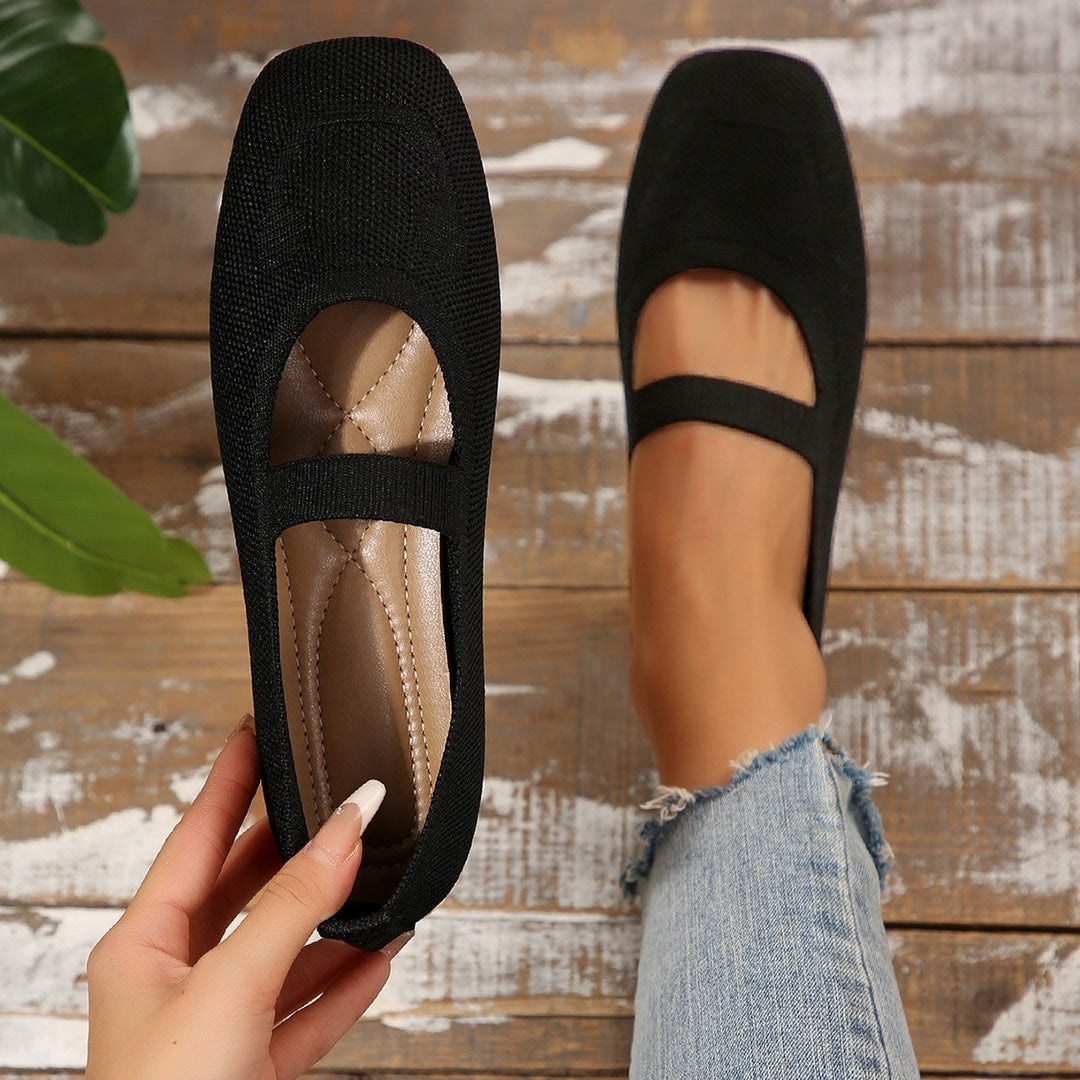 Casual women's ballet flats, Mary Jane design with a distinctive smiling face accent. Perfect for everyday comfortable wear.