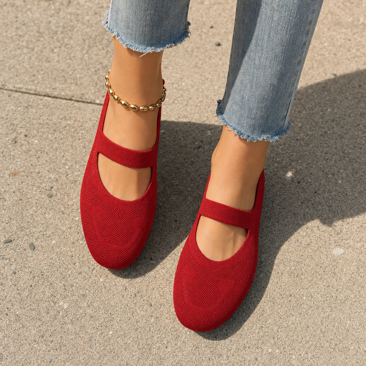 Cute black women's Mary Jane ballet flats featuring a smiling face detail & comfortable slip-on style for everyday fashion.