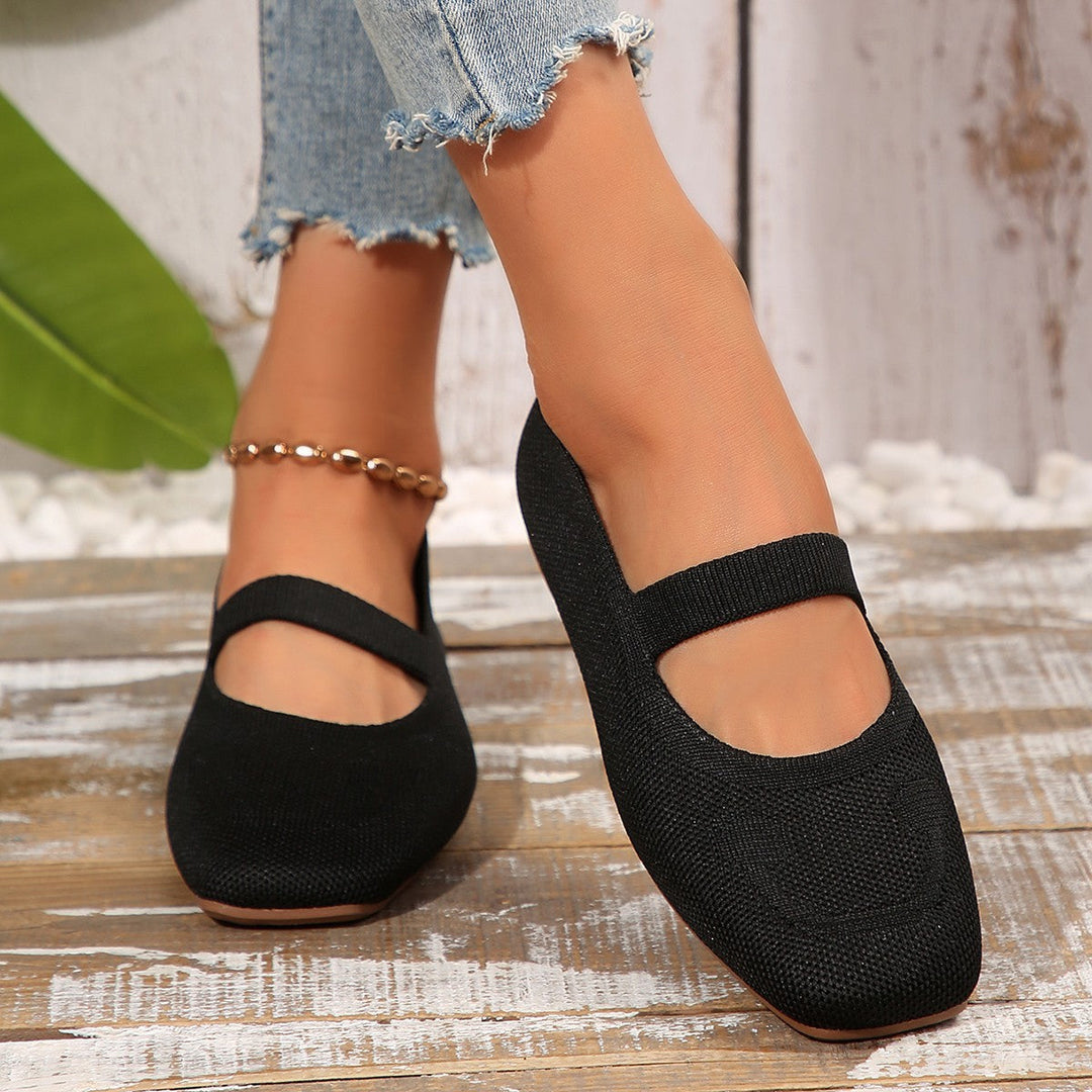 Slip-on women's Mary Jane flats with unique smiling face detail, offering comfort and style for casual outings.