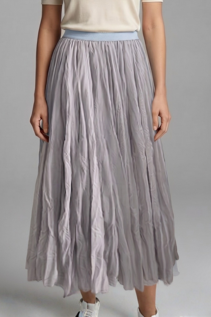 Modern women's pleated maxi skirt, combining a stylish flowy silhouette with a practical elastic waist.