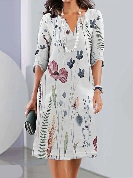 Elegant plus size V-neck midi dress with a vibrant floral pattern and flattering A-line silhouette.