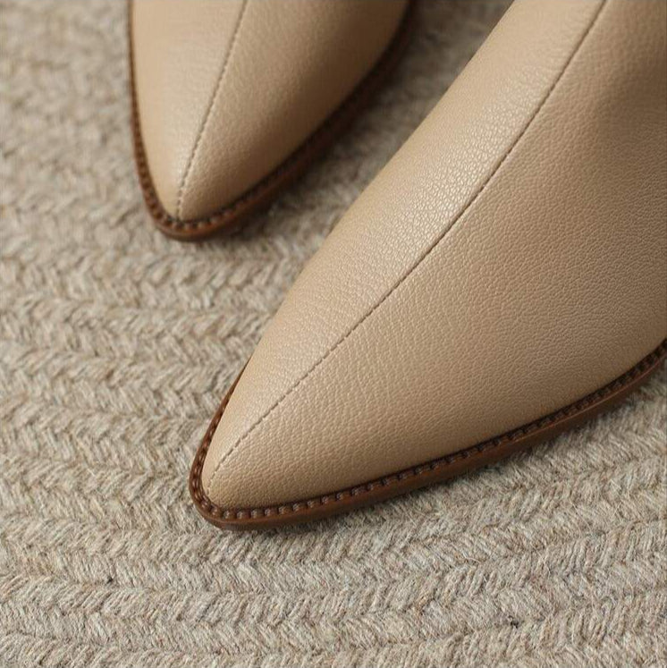Versatile women's pointed toe ankle boots, comfortable slip-on low heel for any occasion.