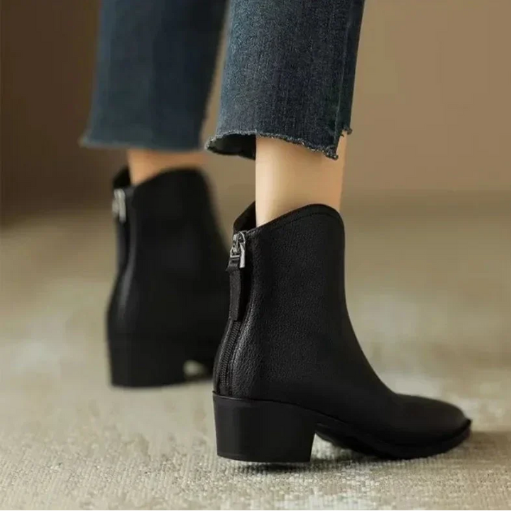 Pointed toe slip-on ankle boots for women, featuring a comfortable low heel.