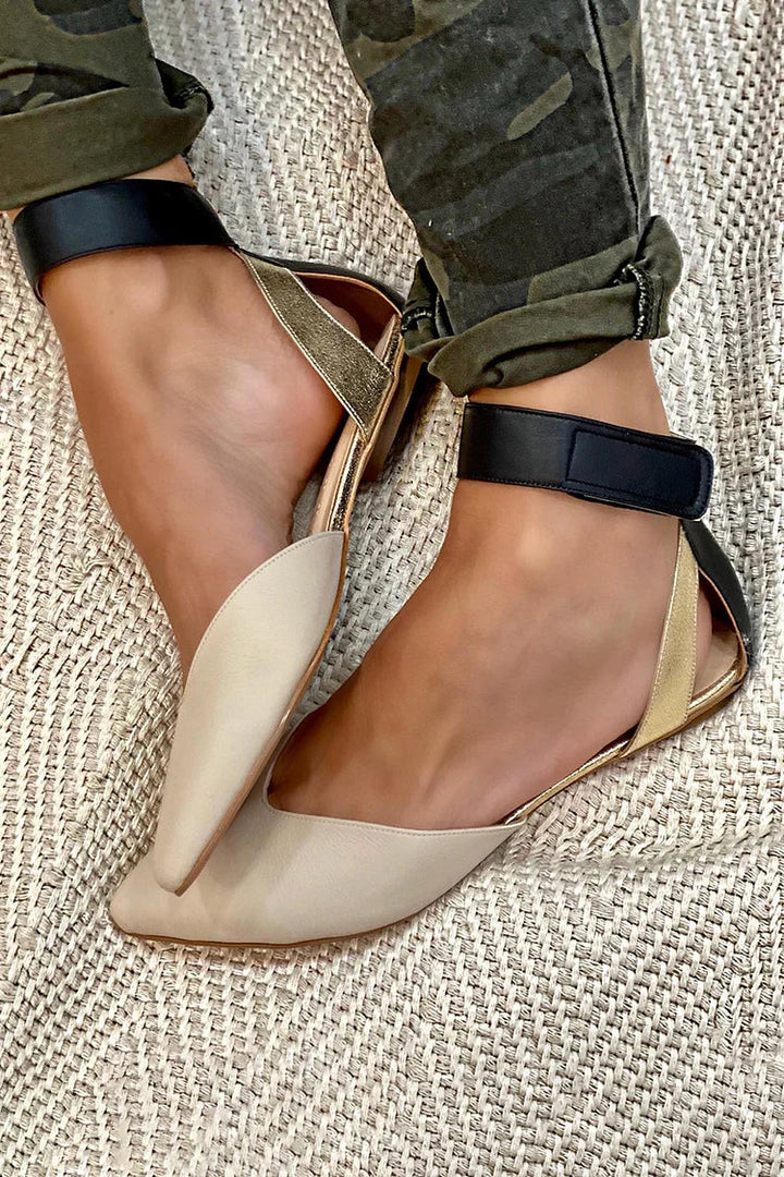 Women's pointed-toe ankle strap flats, ideal for office comfort. Stylish professional footwear for daily wear.