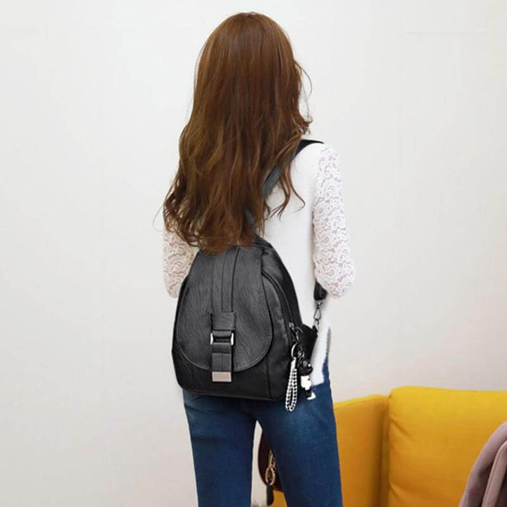 Stylish water-resistant leather backpack for women, a versatile fashion & commute accessory.