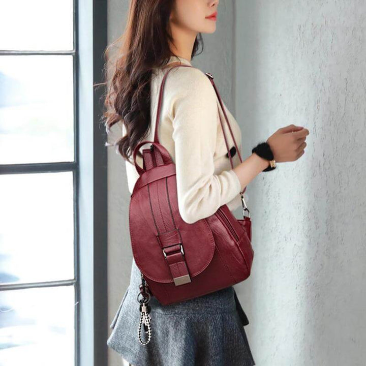Travel-ready women's water-resistant leather backpack, durable and elegantly designed.