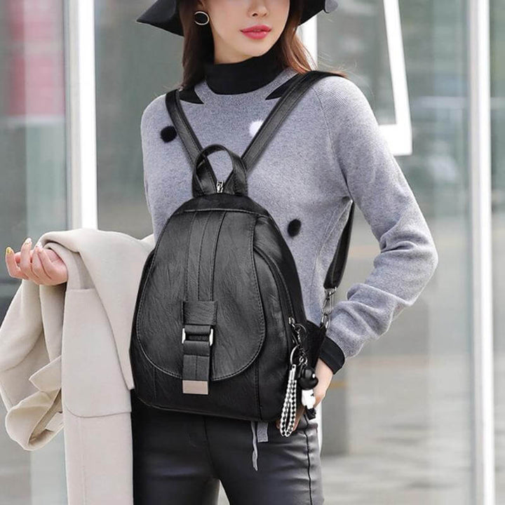 Commute-friendly women's premium leather backpack, water-resistant, ample storage.