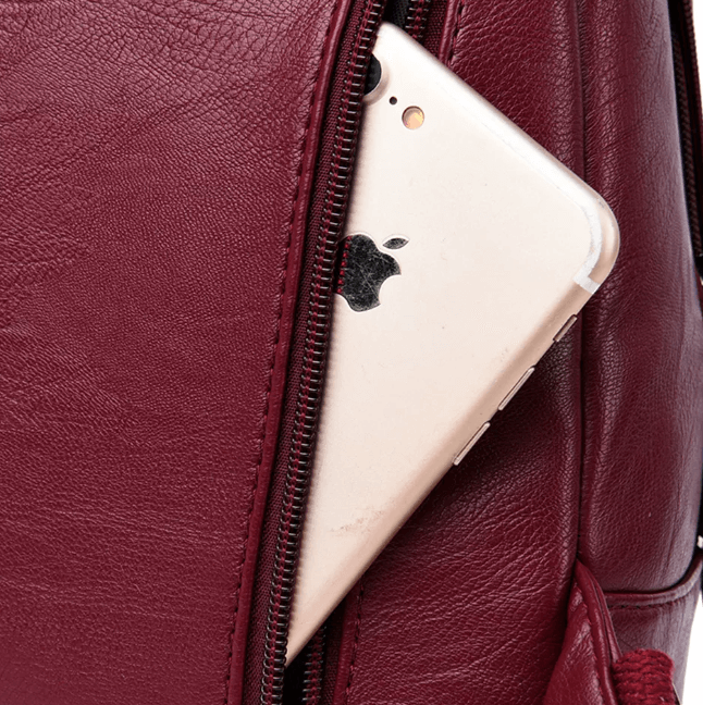 Professional women's premium leather backpack, water-resistant, ideal for business trips.