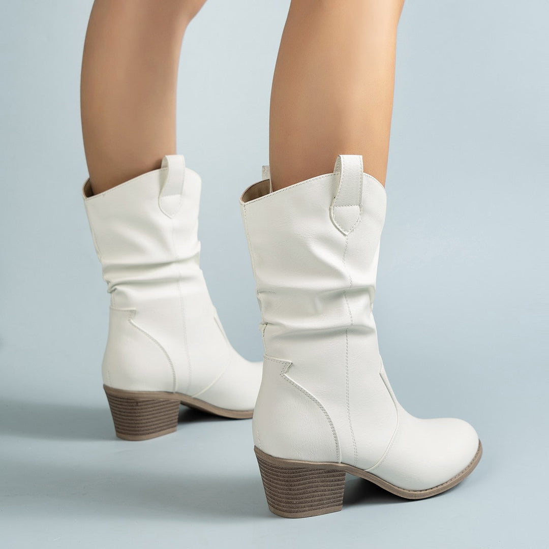 Side profile of a women's mid-calf leather boot, highlighting the classic Western silhouette.