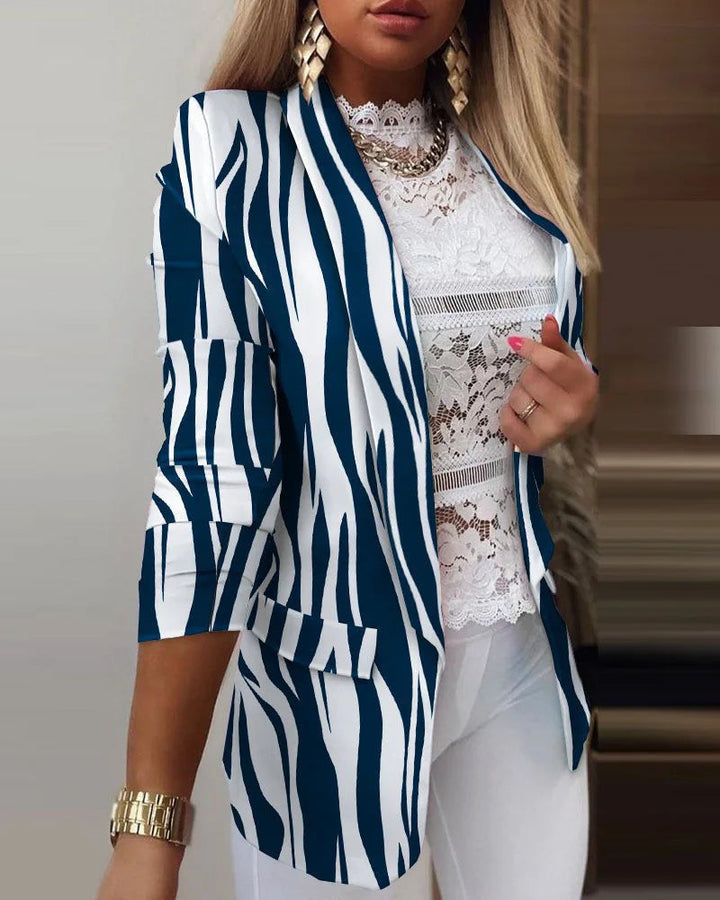 Women's printed 3/4 sleeve open front blazer. Stylish women's fashion for versatile casual or workwear looks.