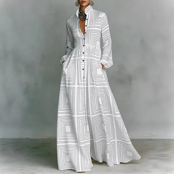 Women's printed bohemian maxi dress with long sleeves, stand collar, & flowy skirt. Perfect for spring/summer.