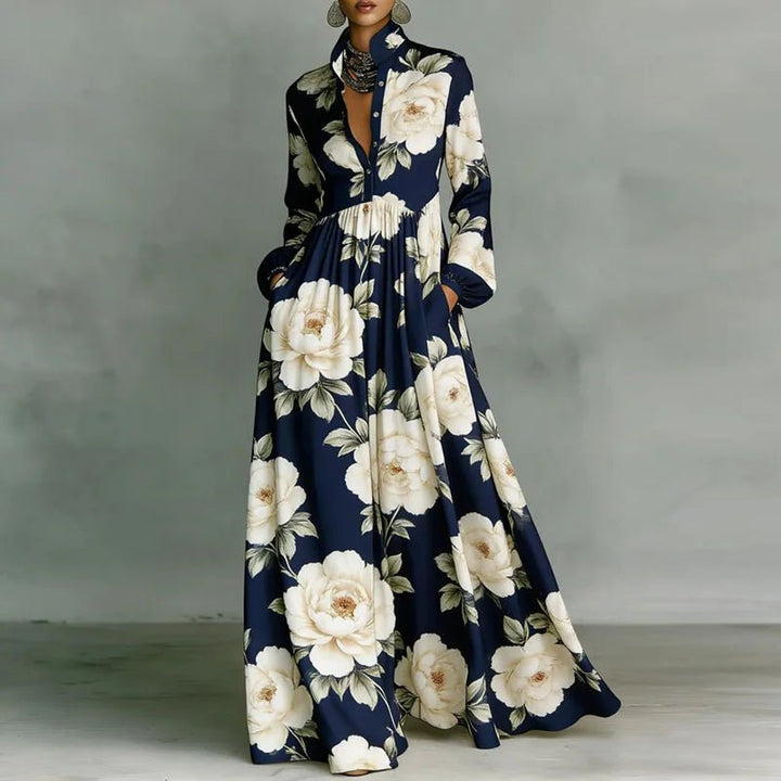 Stylish women's maxi dress. Printed bohemian design, stand collar, long sleeves, & flowy silhouette. Spring/summer.