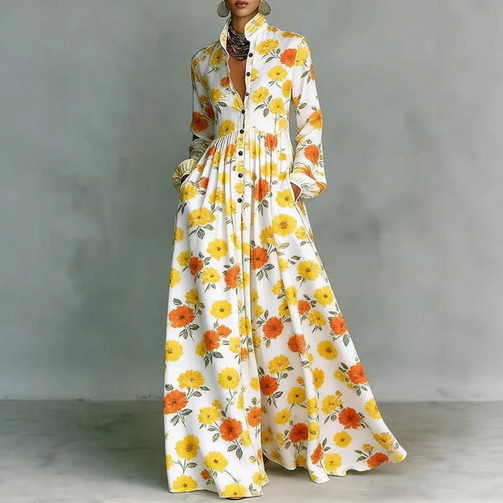 High-waist printed bohemian maxi dress for women. Features stand collar, long sleeves, & elegant flowy skirt. Summer.