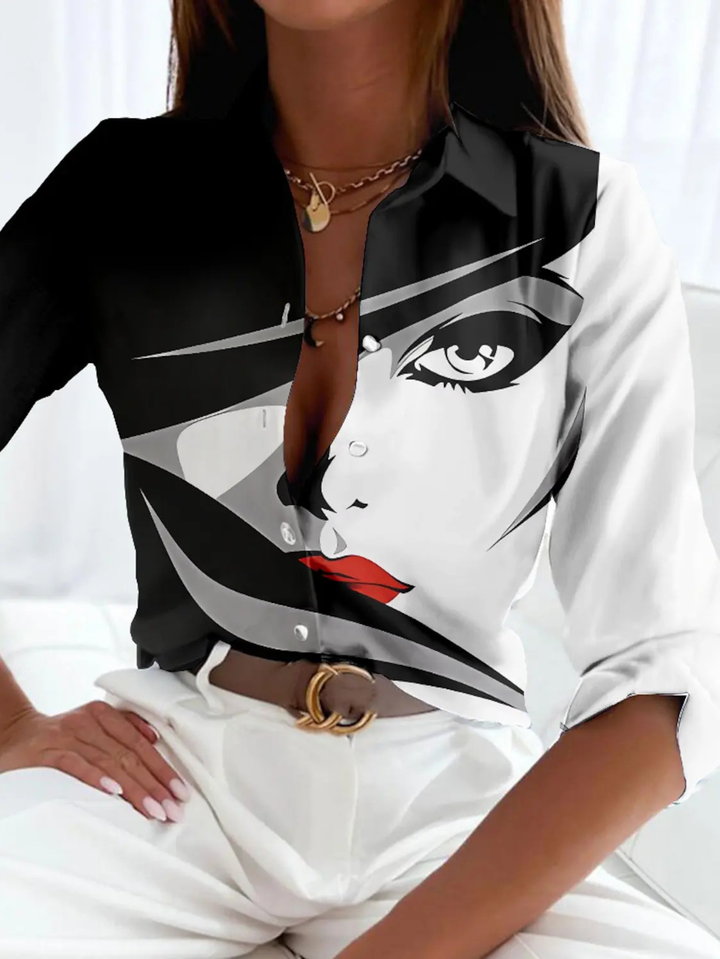 Relaxed fit women's printed button-down blouse. Three-quarter sleeve collared top, perfect for versatile casual chic style.