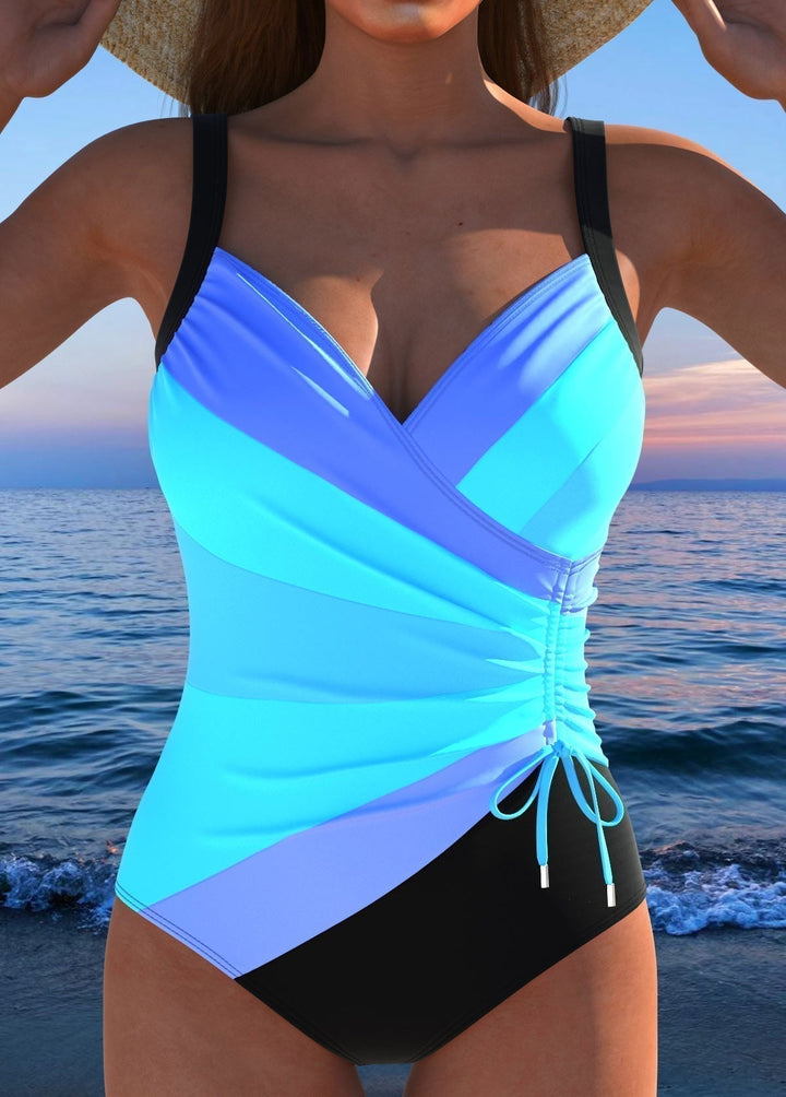 Stylish women's one-piece printed swimsuit featuring a surplice neckline & effective tummy control.