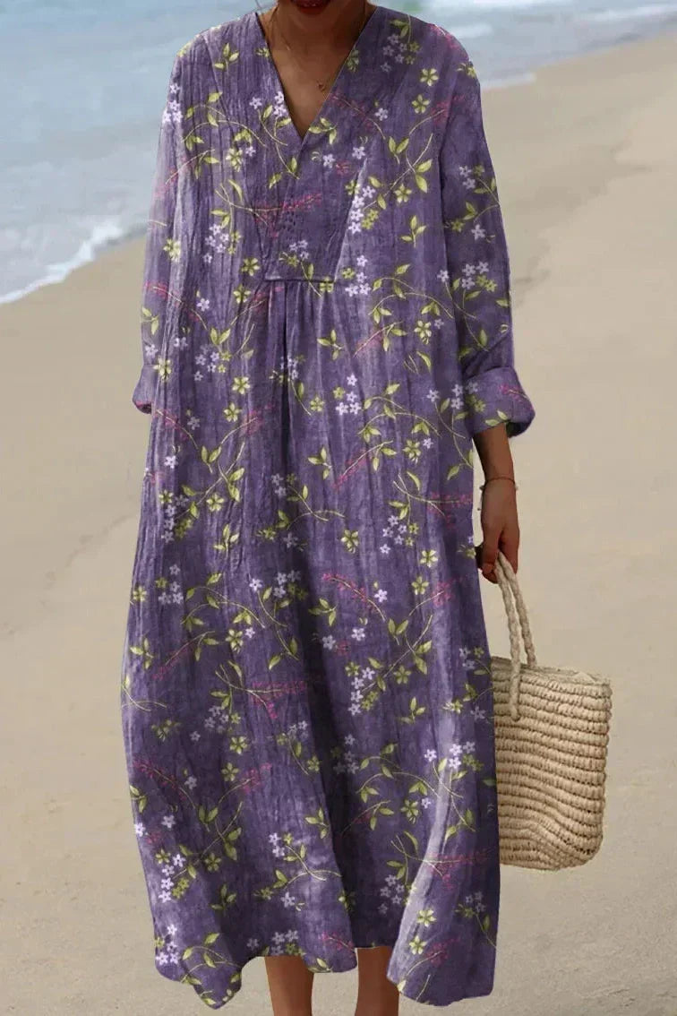 Women's purple floral V-neck flowy midi summer dress. Elegant & comfortable for spring/summer, casual or occasion wear.