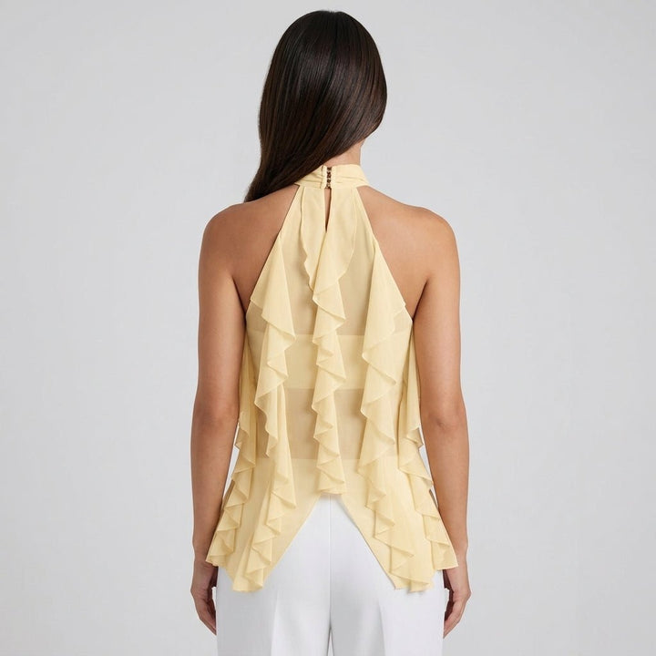 Stylish yellow cascading ruffle halter blouse, a flowy sleeveless top for women.