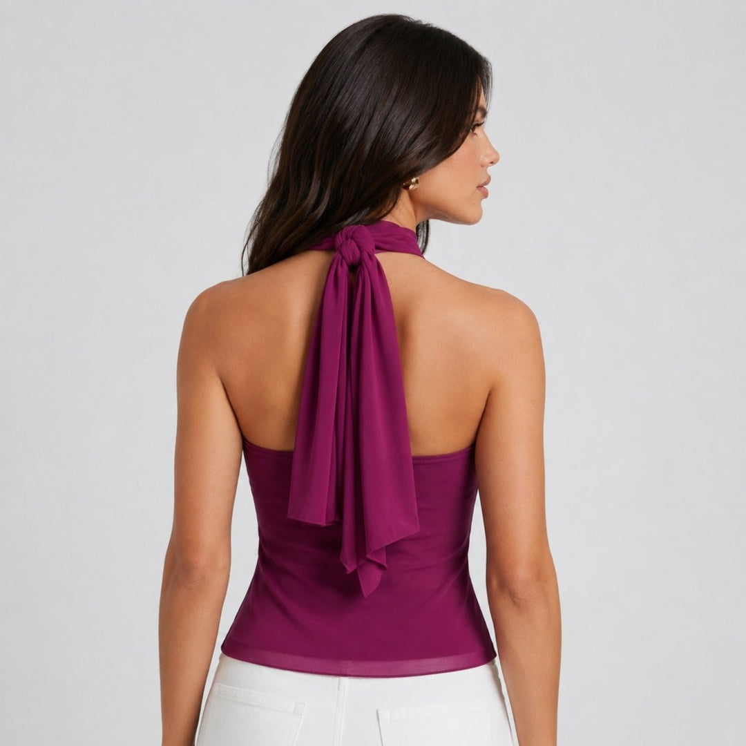 Black ruffled halter blouse with tie back, a chic sleeveless top for special occasions.