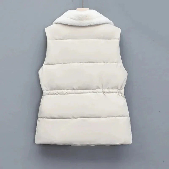 Vibrant colored women's insulated puffer vest, a trendy addition to any winter outfit