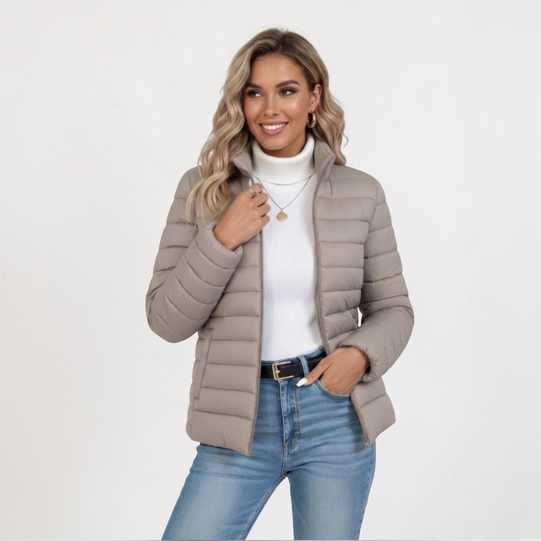 Women's quilted stand collar jacket, lightweight for warmth & everyday wear.