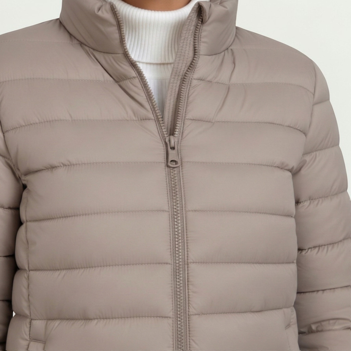 Casual women's quilted zip-up jacket with stand collar, perfect for fall and winter layering.