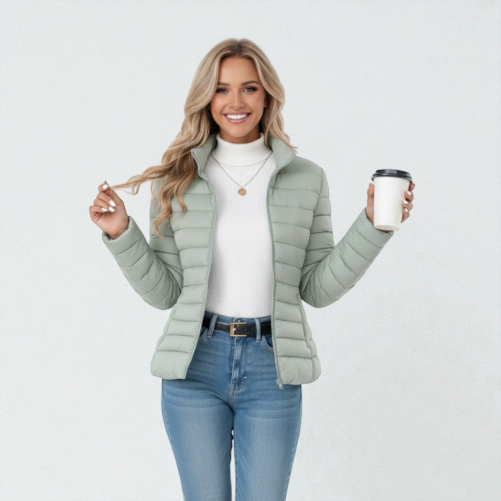 Woman wearing a cozy quilted stand collar jacket, ideal for casual fall & winter outdoor activities.