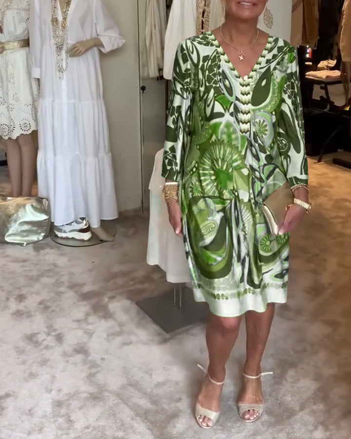 Artistic sunburst design on a women's tunic dress, perfect for vibrant summer fashion.