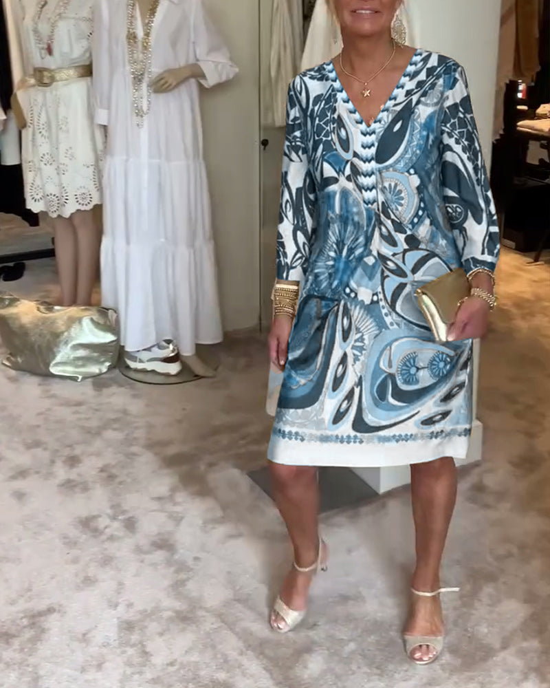 Women's vibrant sunburst printed tunic dress, casual retro style for summer vacations.