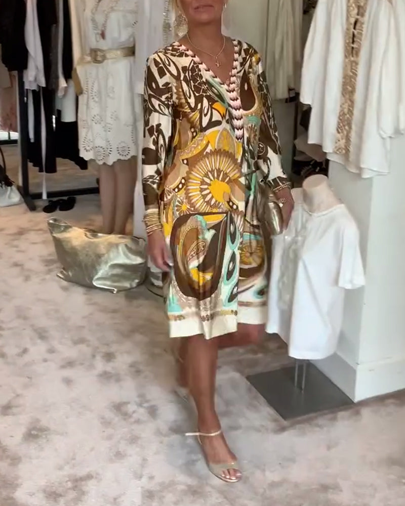 Retro sunburst printed tunic dress, comfortable and vibrant for casual summer wear.