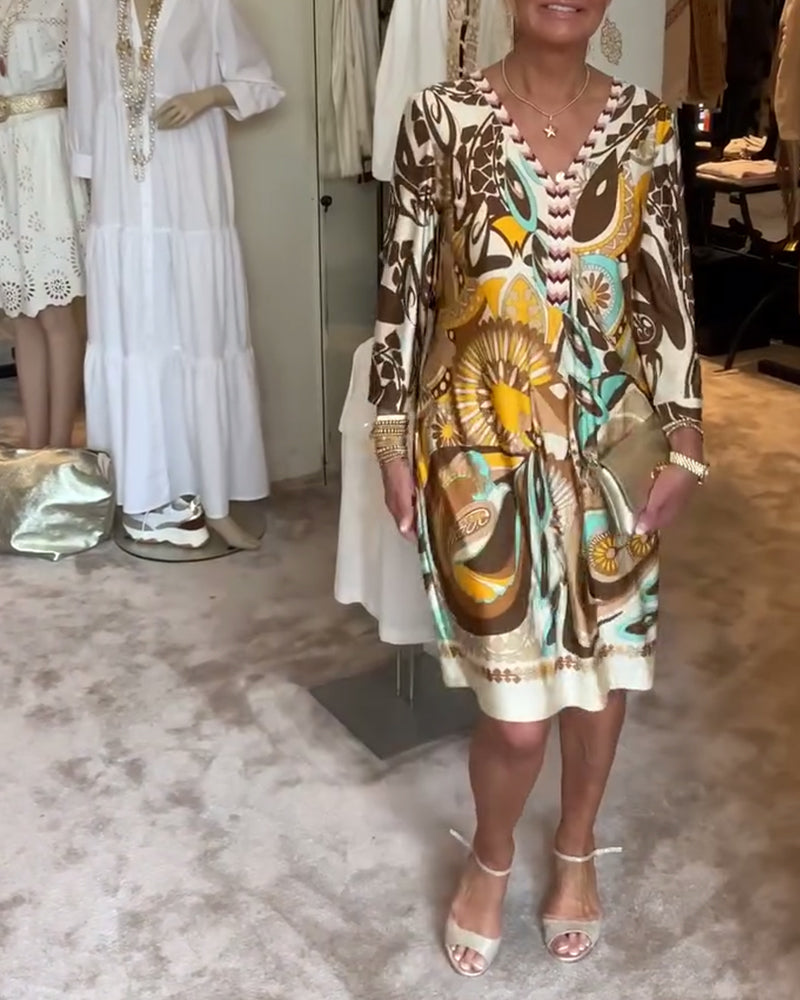 Artistic sunburst print women's casual dress, perfect for a bohemian summer vacation.
