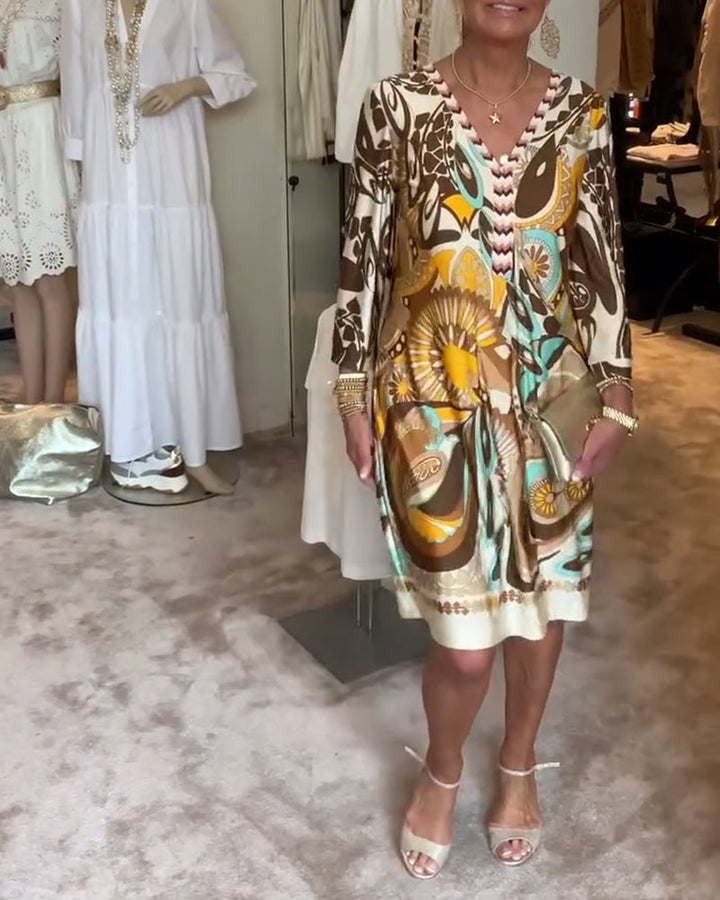 Artistic sunburst print women's casual dress, perfect for a bohemian summer vacation.