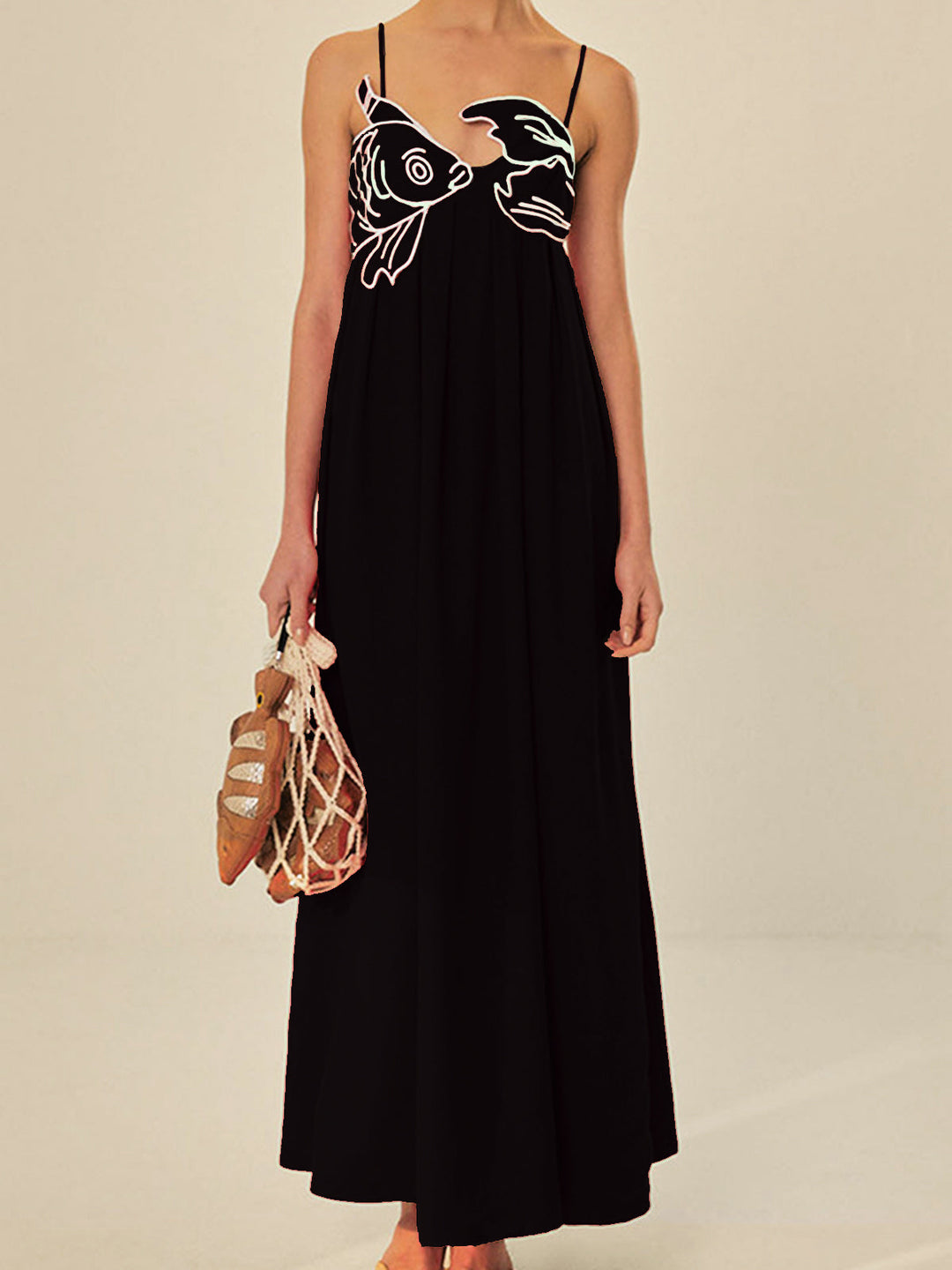 Black embroidered maxi shift dress for women, with comfortable flowing fit & spaghetti straps. Casual summer style.